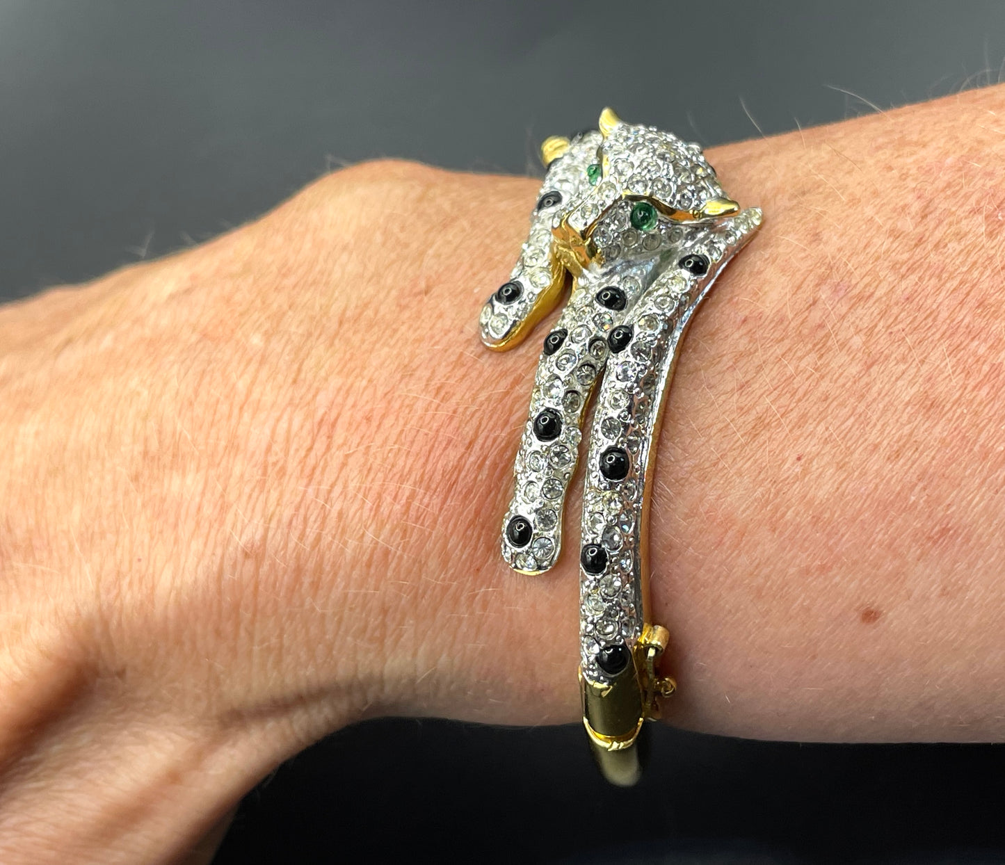 Vintage leopard / panther bangle, gold plated, green and black glass cabochons, clear rhinestones, interesting stamp signature