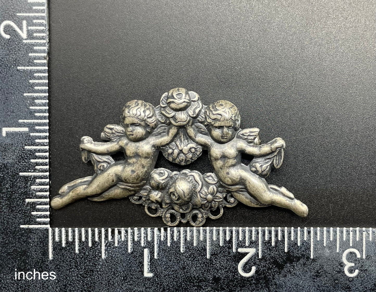 Possibly early Askew London, vintage cherub cupid floral brooch in antique silver tone