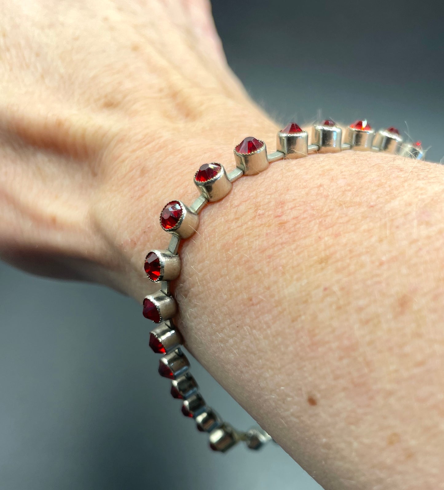 Vintage 1930s Art Deco collet set bright ruby red rhinestone and silver tone tennis / cocktail bracelet