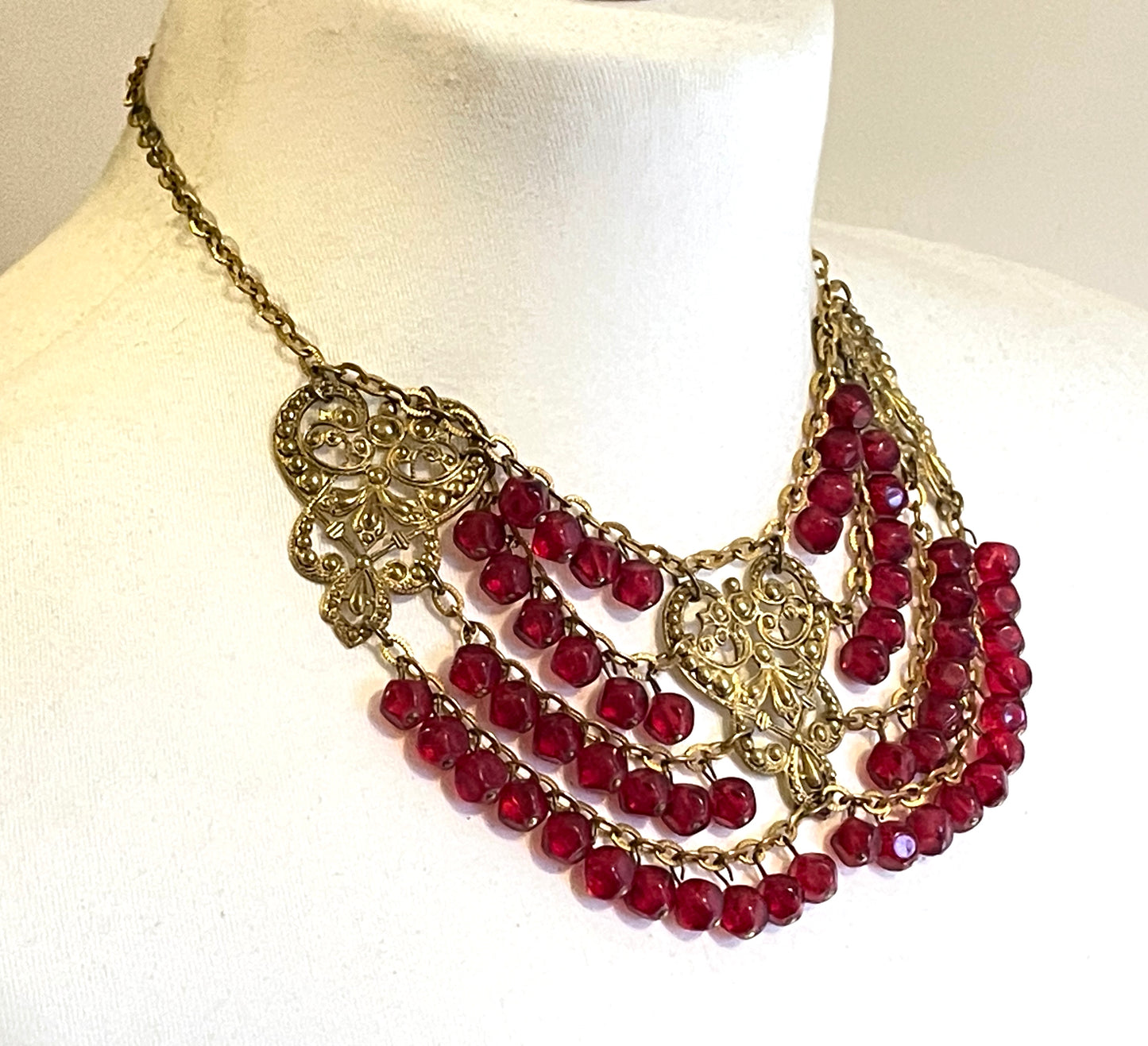 Vintage ruby red poured glass beaded festoon fringe necklace with gold tone filigree panels, French or Czech or perhaps Miriam Haskell style