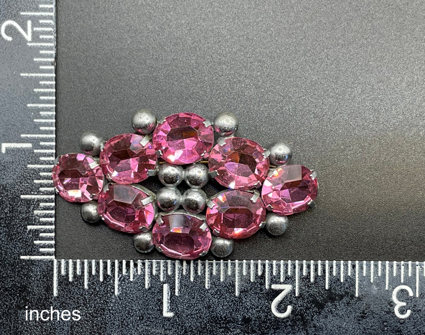 Vintage Art Deco chrome and ruby pink glass open-backed rhinestone brooch pin, machine age