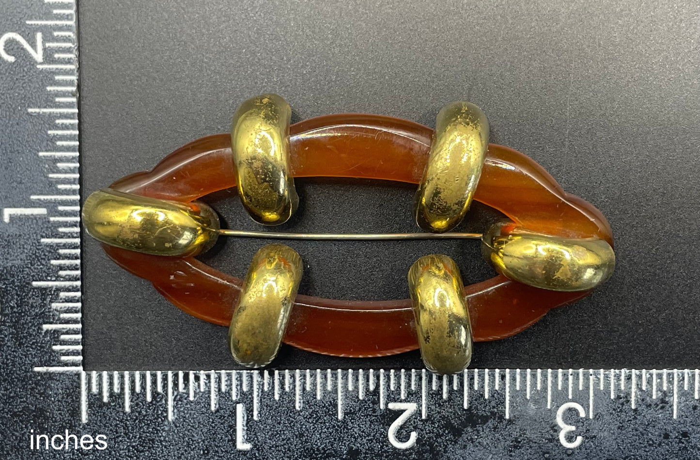 Large vintage rootbeer Bakelite (verified) and gold tone Art Deco machine age geometric brooch, classic 1930s design