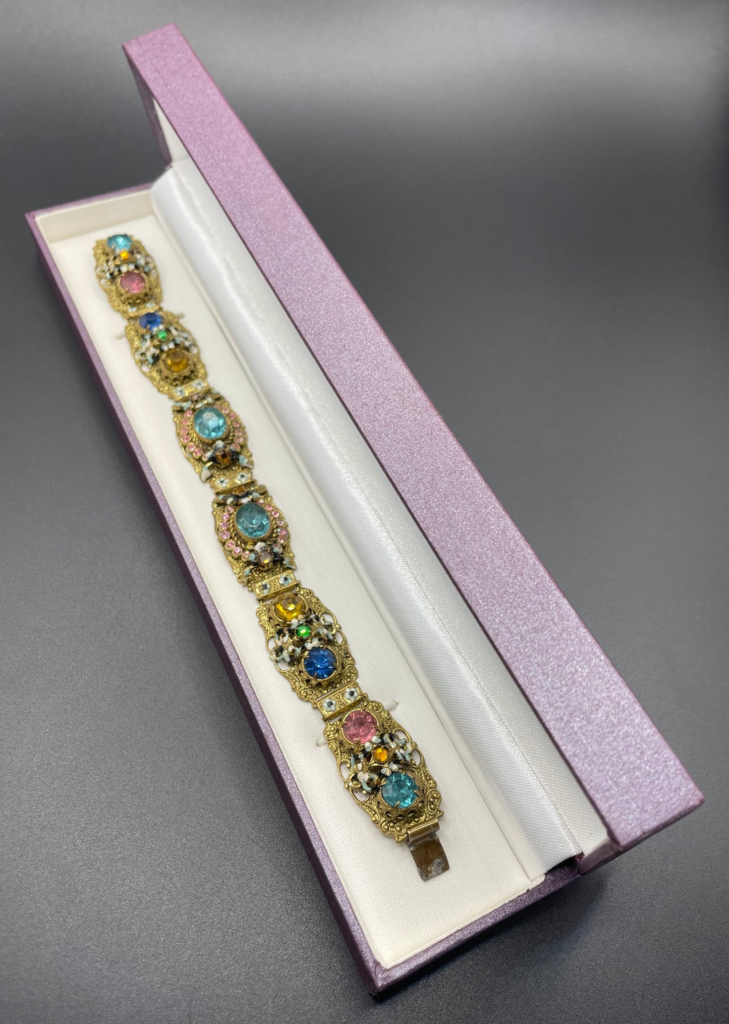 Vintage Art Deco Czech gold tone filigree, multicoloured glass rhinestone and cold painted enamel panel bracelet, possibly Neiger Brothers