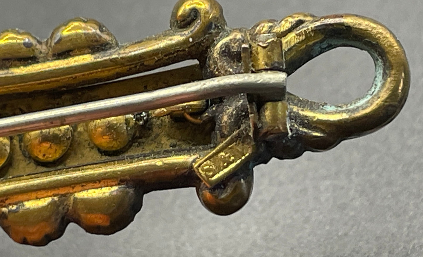 Adorable small antique Victorian gold tone (probably rolled gold) and silver fronted brooch, with clear and green (untested) stones, stamped