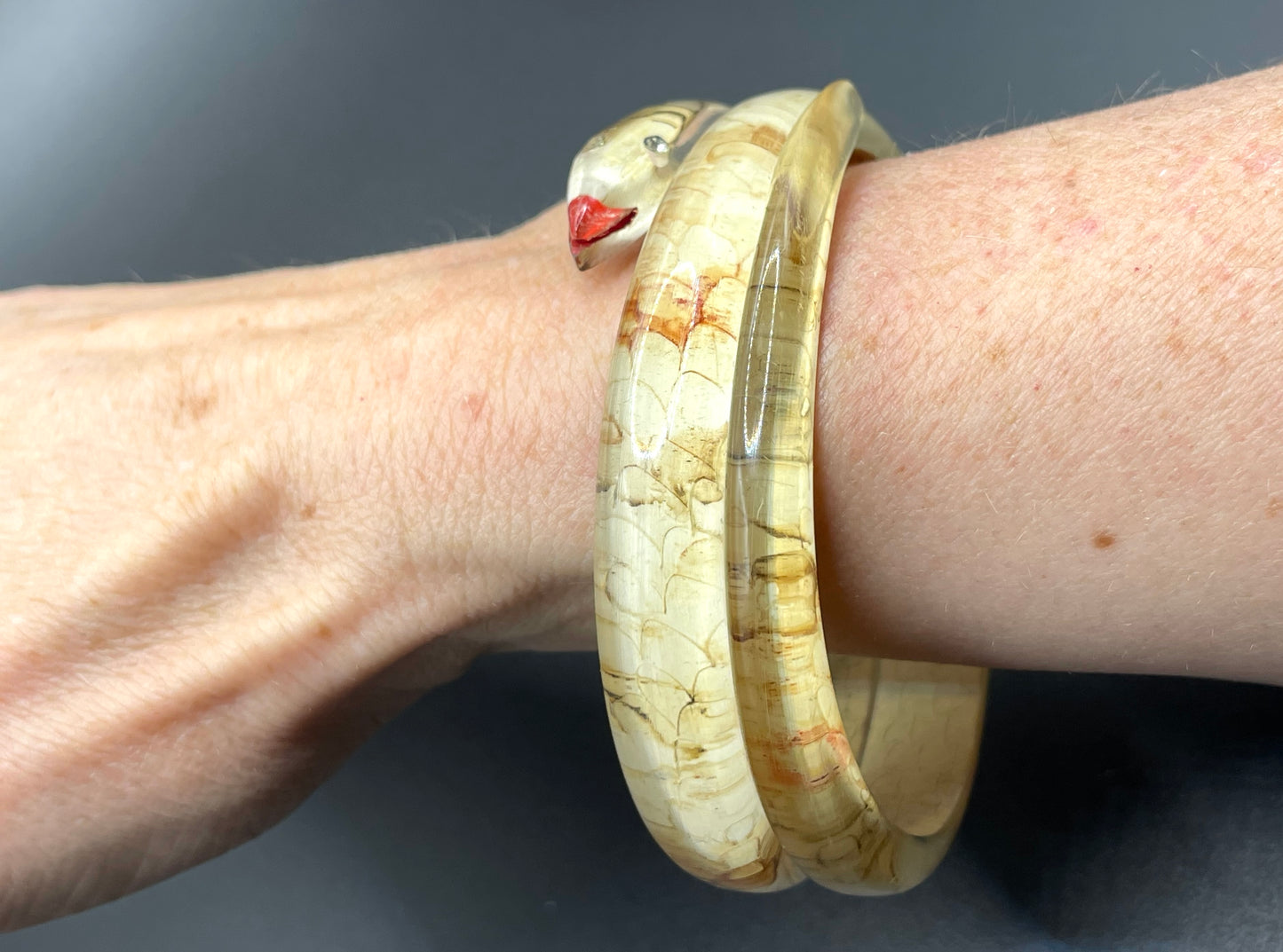 Vintage Art Deco 1920s to 1930s reverse painted, clear celluloid spiral snake bangle bracelet, clear rhinestone eyes
