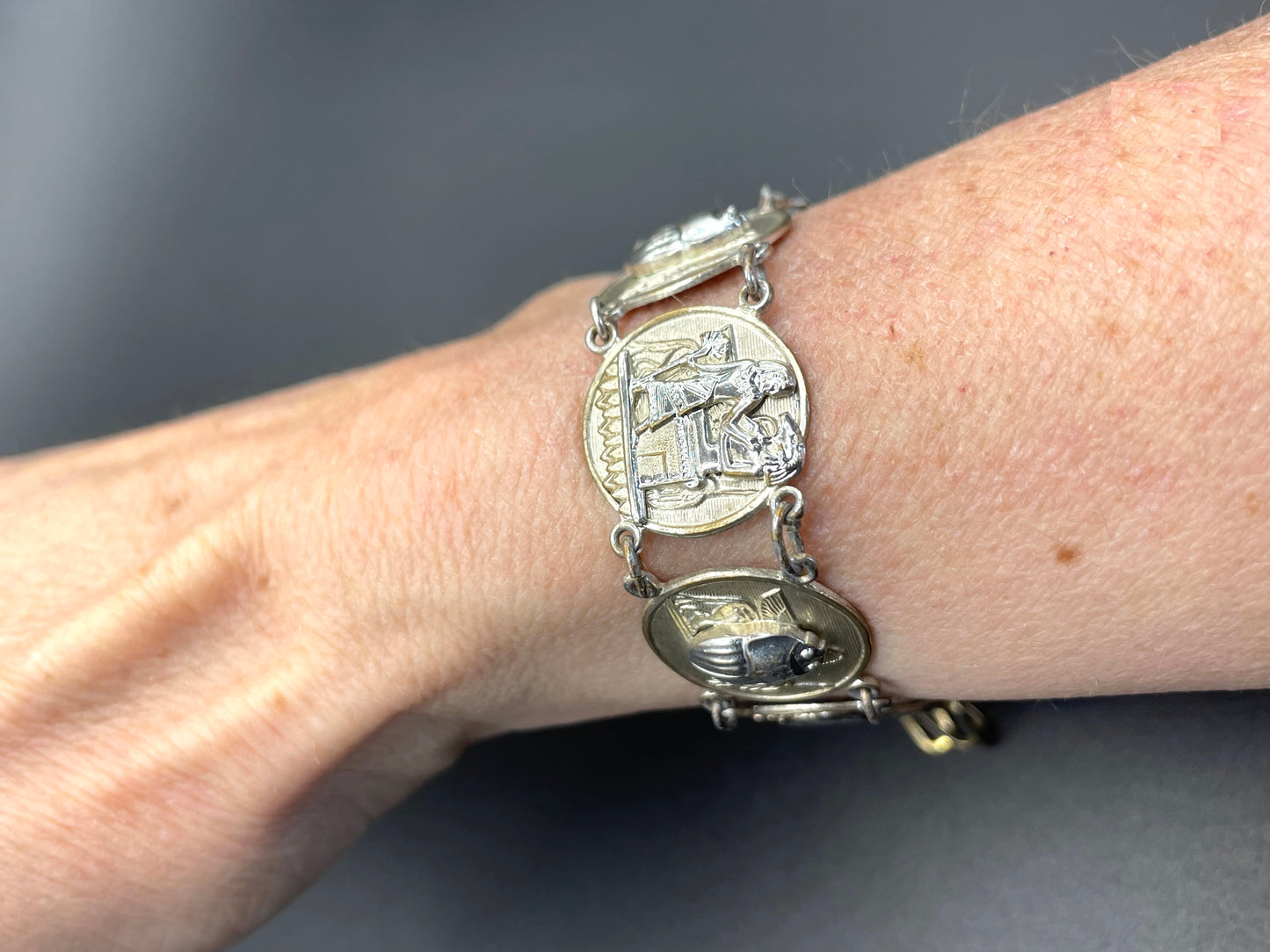 Vintage Egyptian revival scarab, pharaoh and hieroglyphics design silver tone circular panel bracelet, rubbing to silver tone