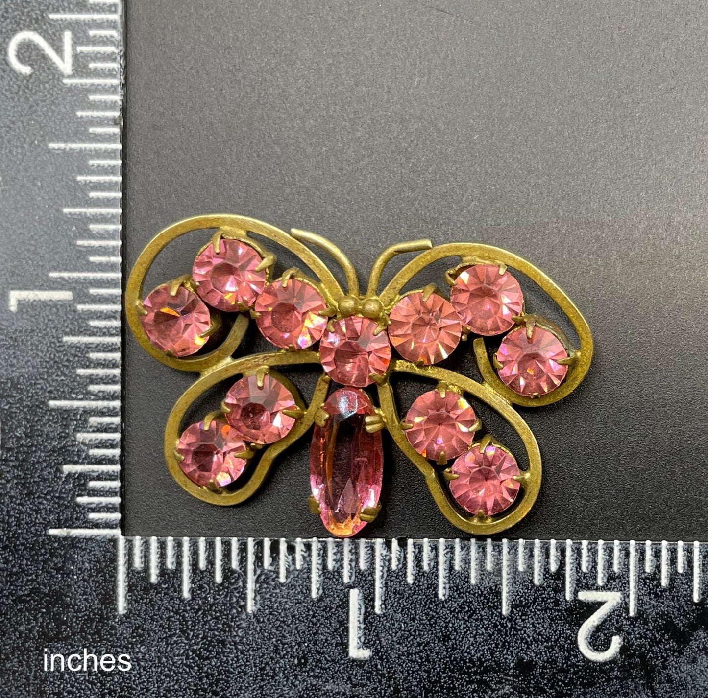 Vintage Art Deco Czech butterfly brooch, pink glass rhinestones, set open-backed in antique gold tone