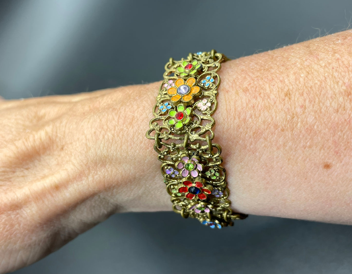 Vintage Art Deco Czech gold tone filigree, multicoloured glass rhinestone and cold painted enamel panel bracelet