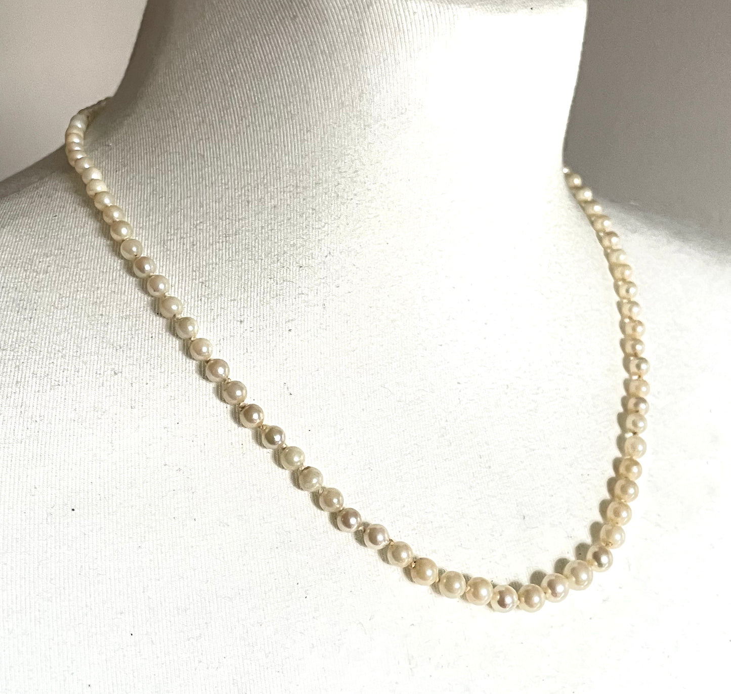Vintage real cultured pearl necklace, graduated in size, hand-knotted, pretty engraved sterling silver clasp, mid-length