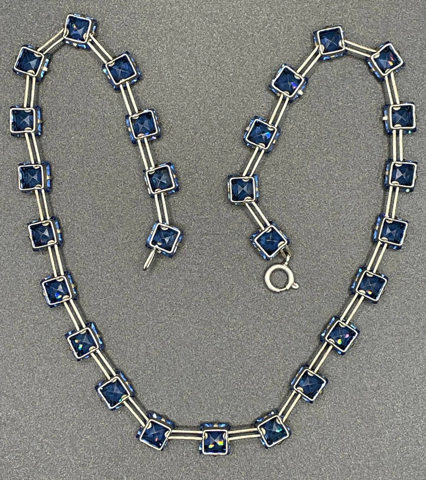 Vintage Sterling silver Art Deco bezel set sapphire blue crystal riviere necklace, open-backed princess cut (square) rhinestones, hallmarked, by W H Collins