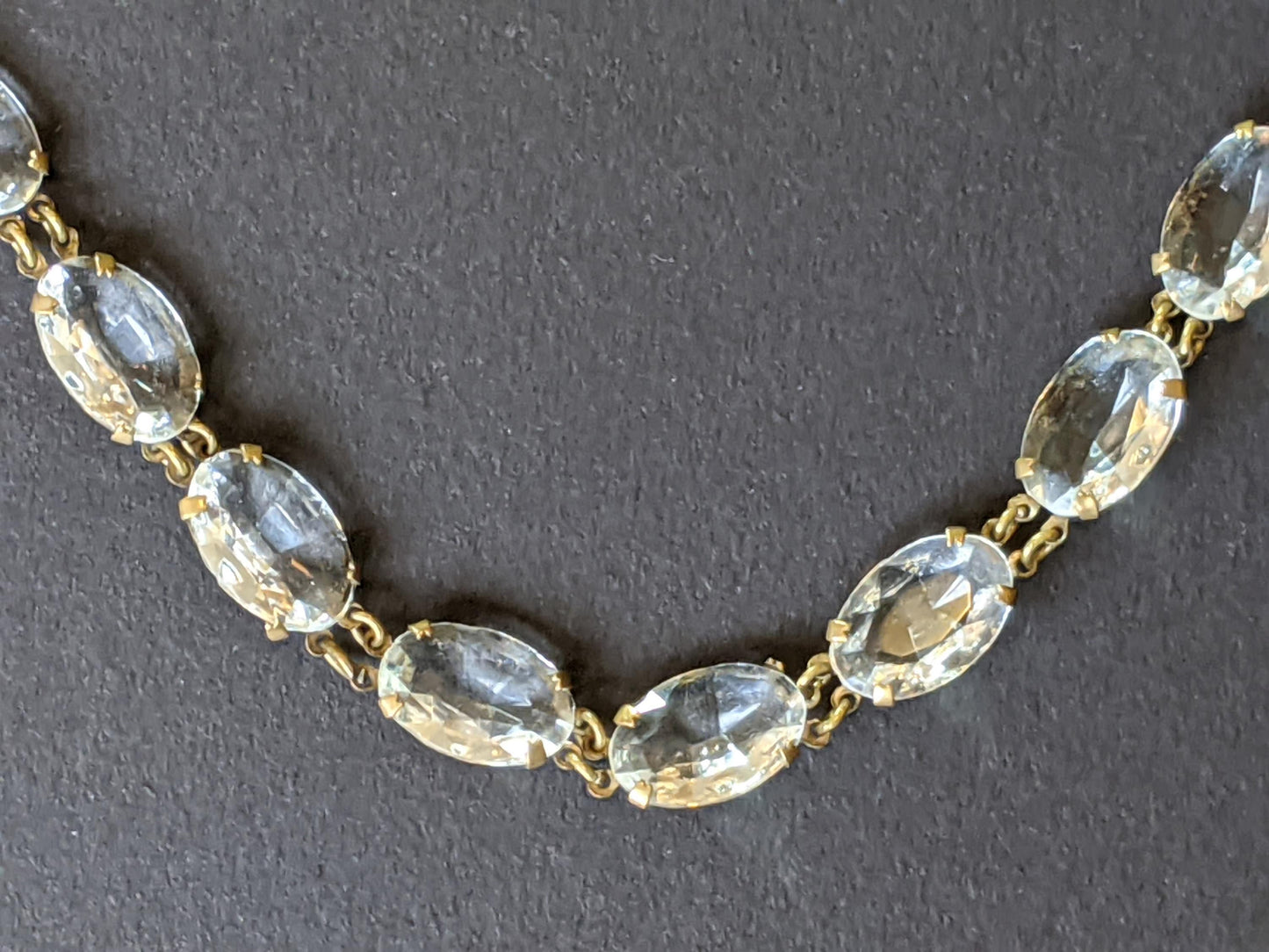 Vintage Art Deco clear paste large oval crystal riviere necklace, bezel set open backed Czech crystal stones set in gold tone