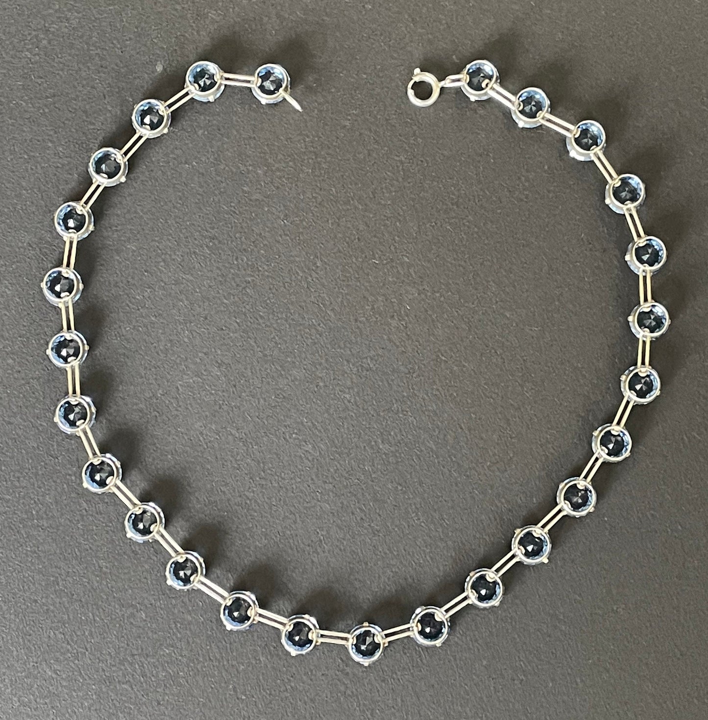 Vintage sterling silver Art Deco sapphire blue chaton cut crystal rhinestone riviere necklace bezel set, open backed, by W H Collins