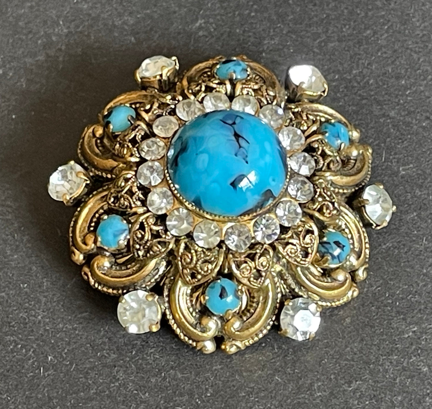 Large vintage Art Deco faux turquoise glass cabochon, clear paste rhinestone and gold tone filigree Czech flower brooch