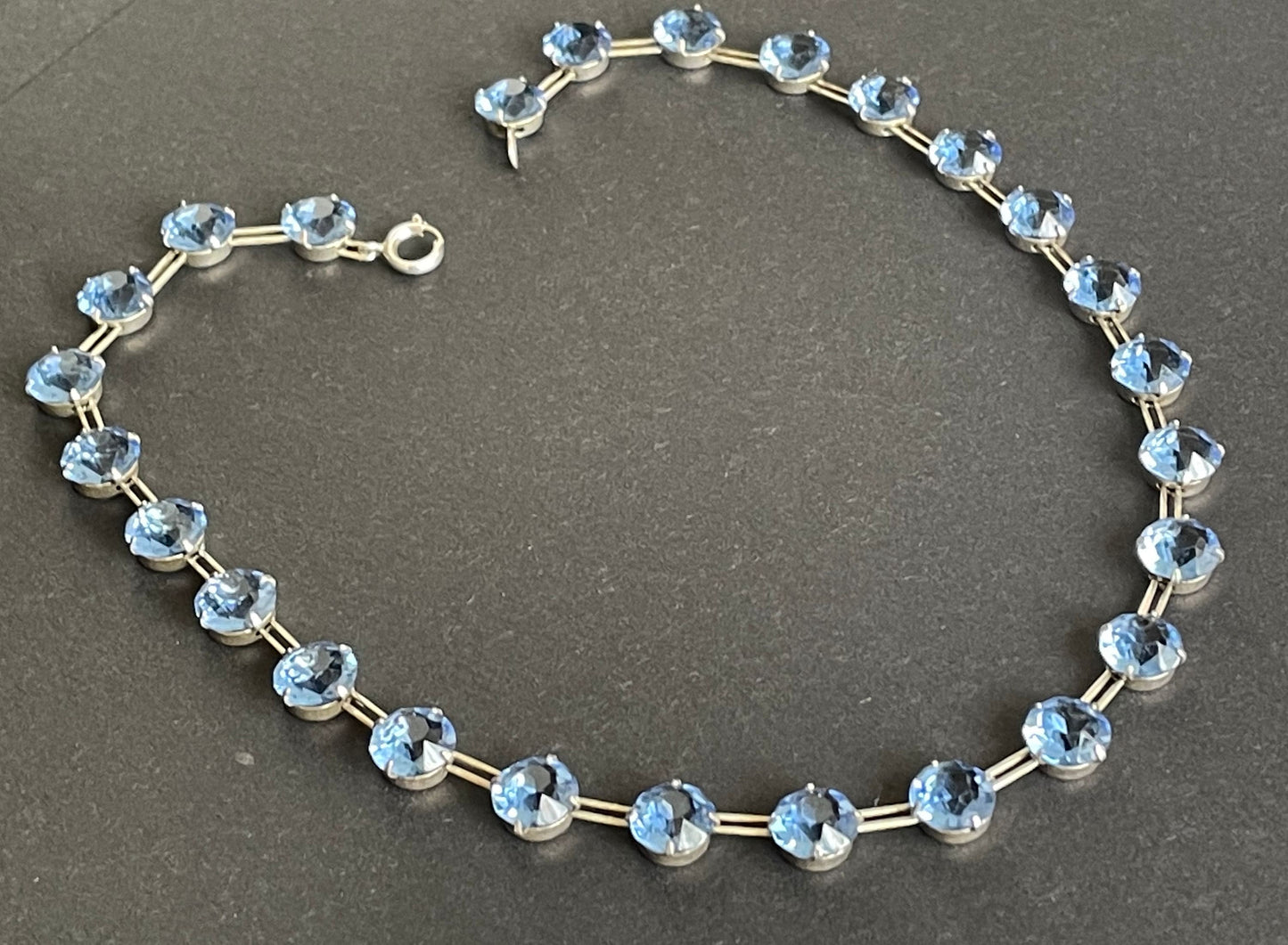 Vintage sterling silver Art Deco sapphire blue chaton cut crystal rhinestone riviere necklace bezel set, open backed, by W H Collins