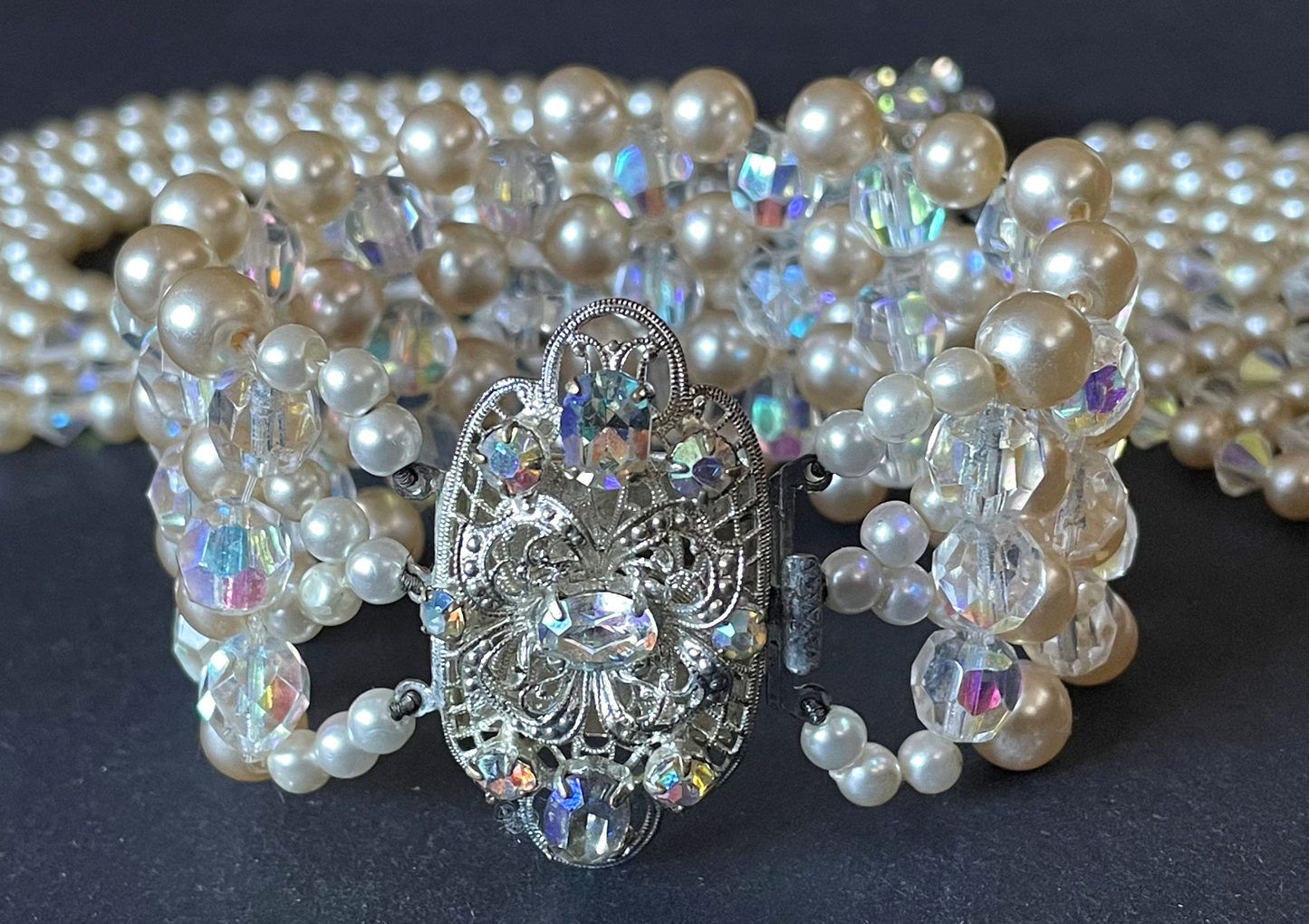 Vintage multi five strand glass faux pearl and crystal bead necklace and matching bracelet, each with large ornate rhinestone box clasp