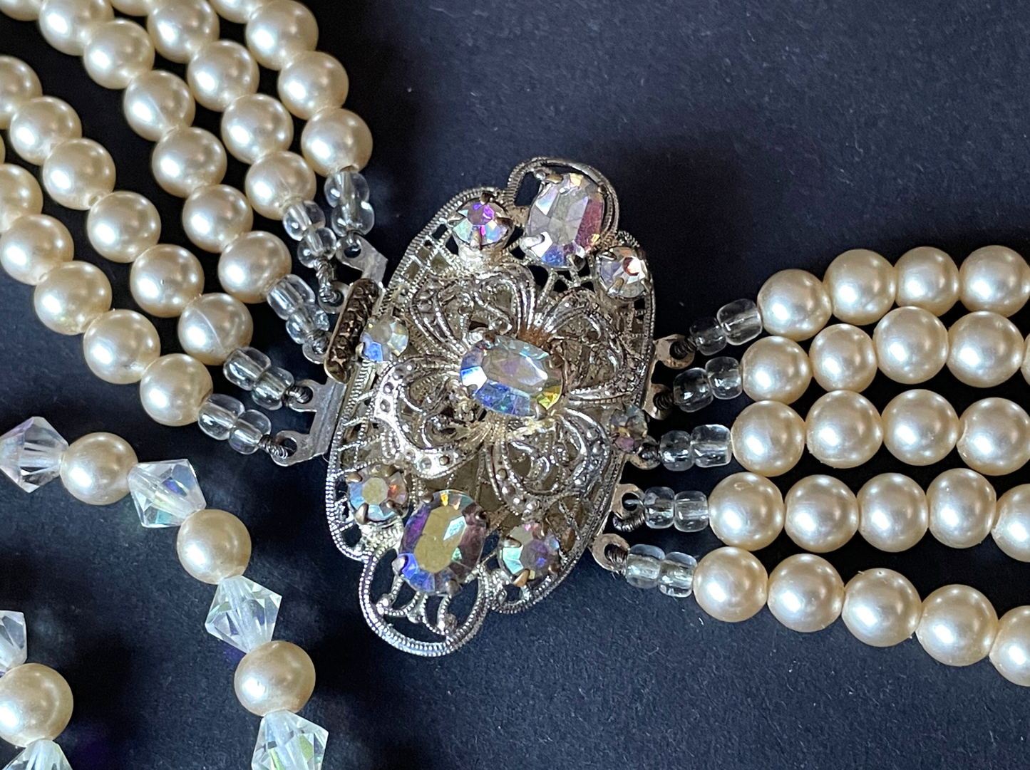 Vintage multi five strand glass faux pearl and crystal bead necklace and matching bracelet, each with large ornate rhinestone box clasp