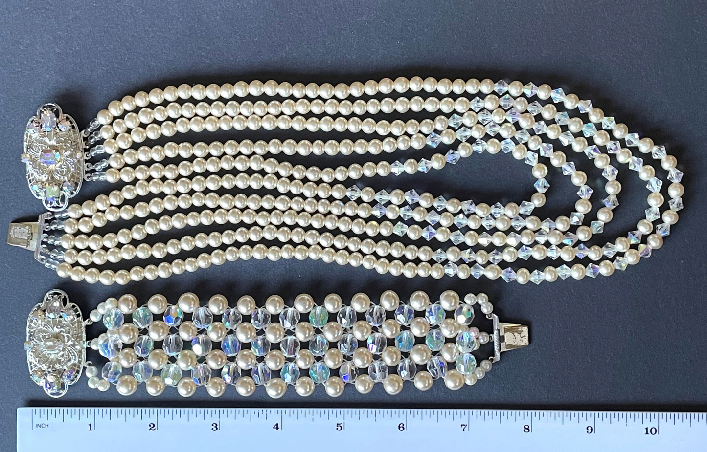 Vintage multi five strand glass faux pearl and crystal bead necklace and matching bracelet, each with large ornate rhinestone box clasp