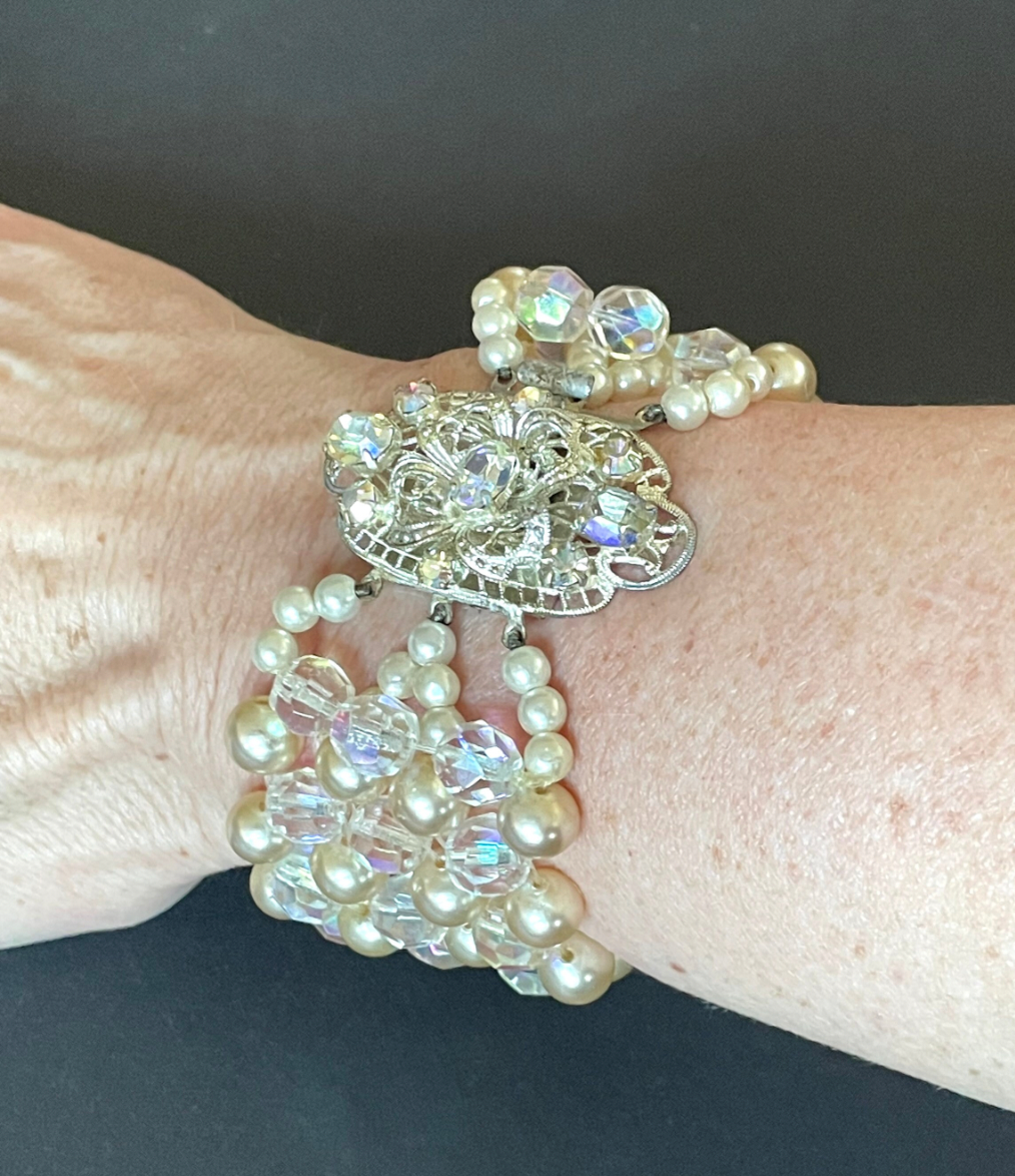 Vintage multi five strand glass faux pearl and crystal bead necklace and matching bracelet, each with large ornate rhinestone box clasp