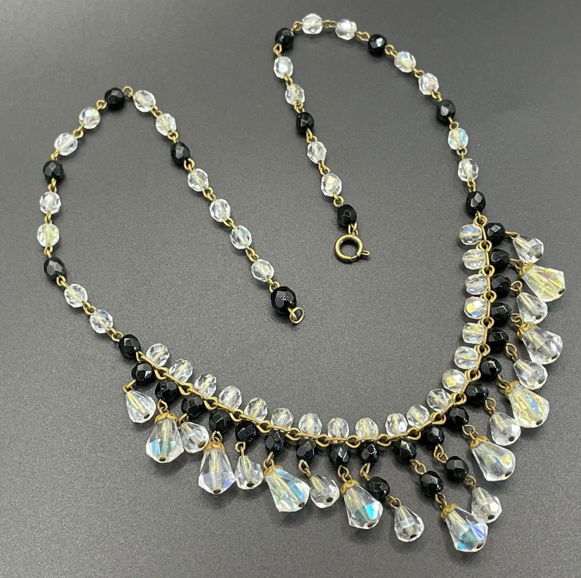 Vintage black and clear aurora borealis crystal faceted cut glass beaded fringe necklace with gold tone, delicate monochrome design