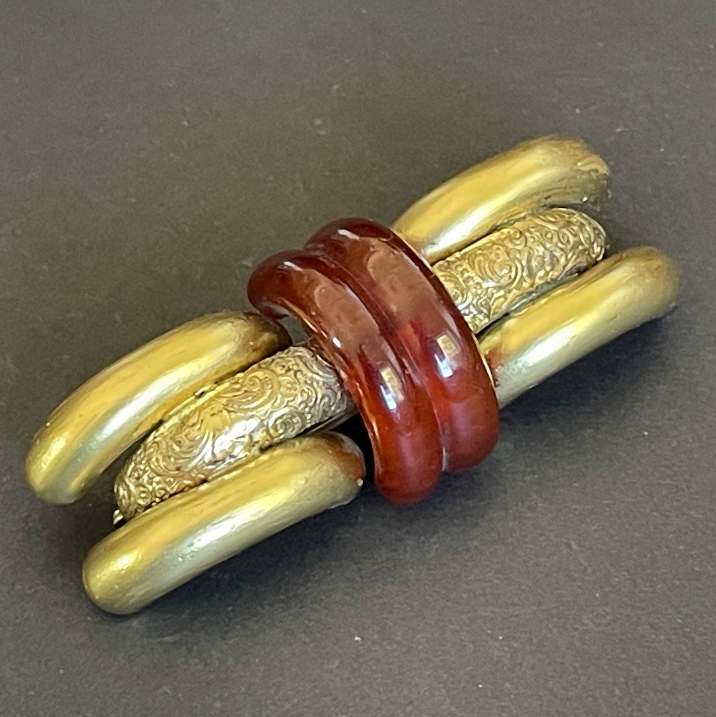 Large vintage rootbeer Bakelite (verified) and gold tone pinchbeck ? Art Deco machine age geometric brooch, classic 1930s design