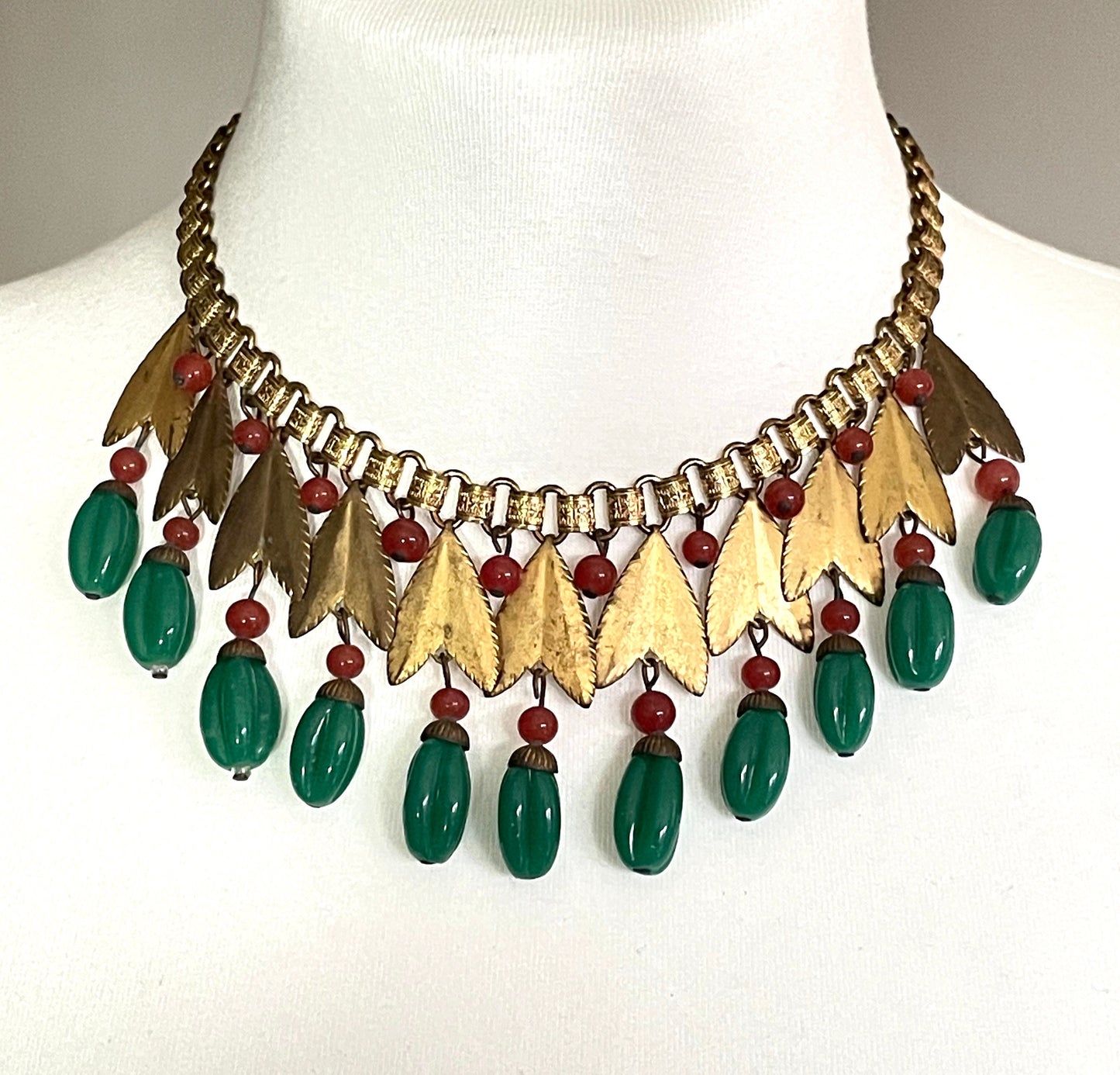 Vintage early Miriam Haskell jade green and orange poured glass beaded and gold tone Egyptian revival fringe necklace with book chain links