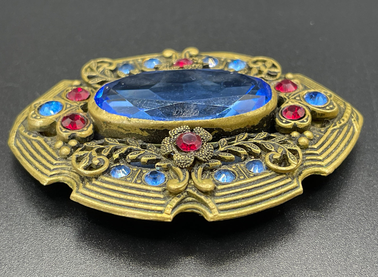 Large vintage Art Deco sapphire blue and bright ruby red rhinestone and ornate gold tone floral design Czech brooch, Neiger style