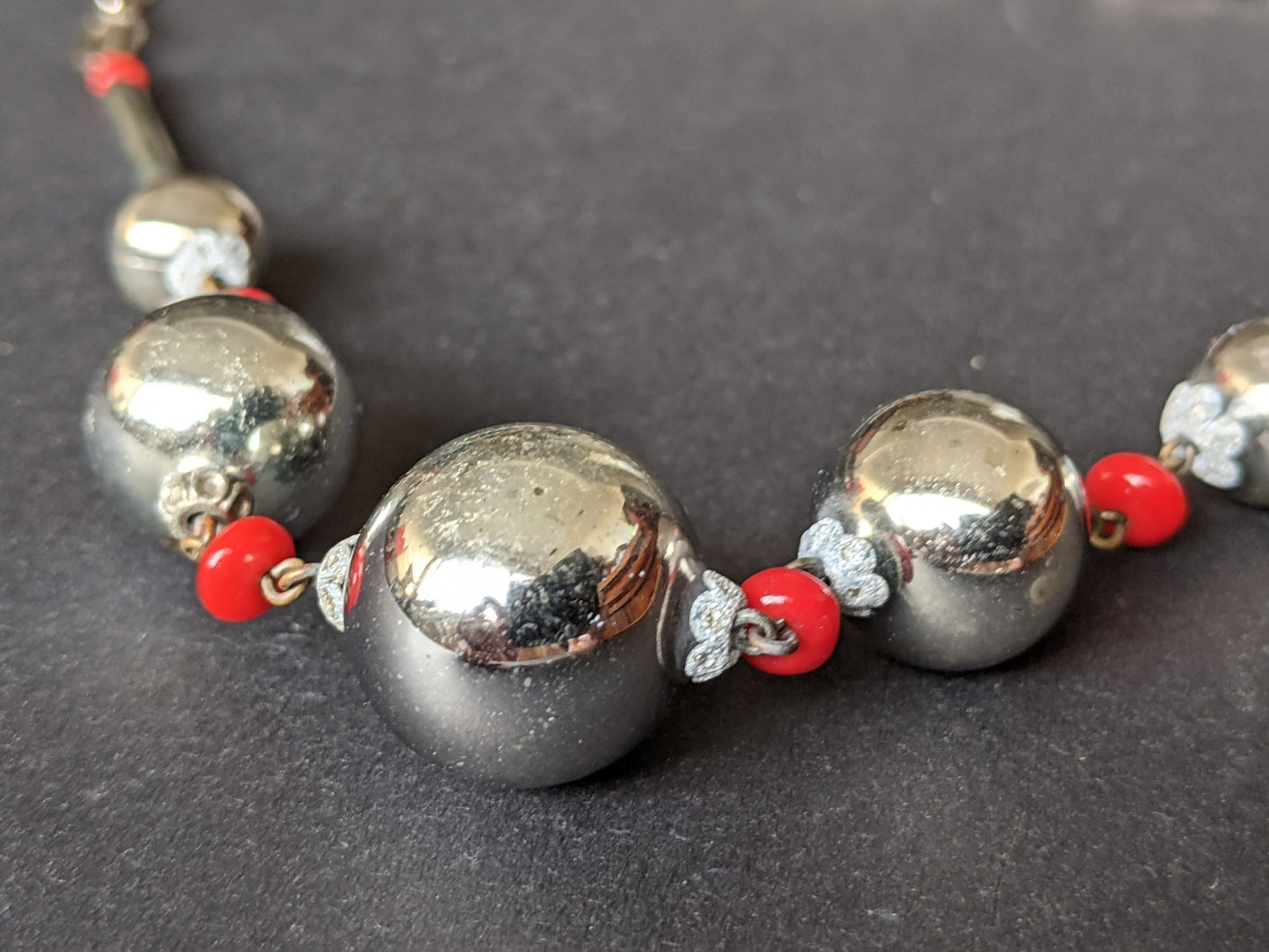 Vintage Art Deco silvered hollow blown glass beads and chrome machine age necklace with red glass accent beads