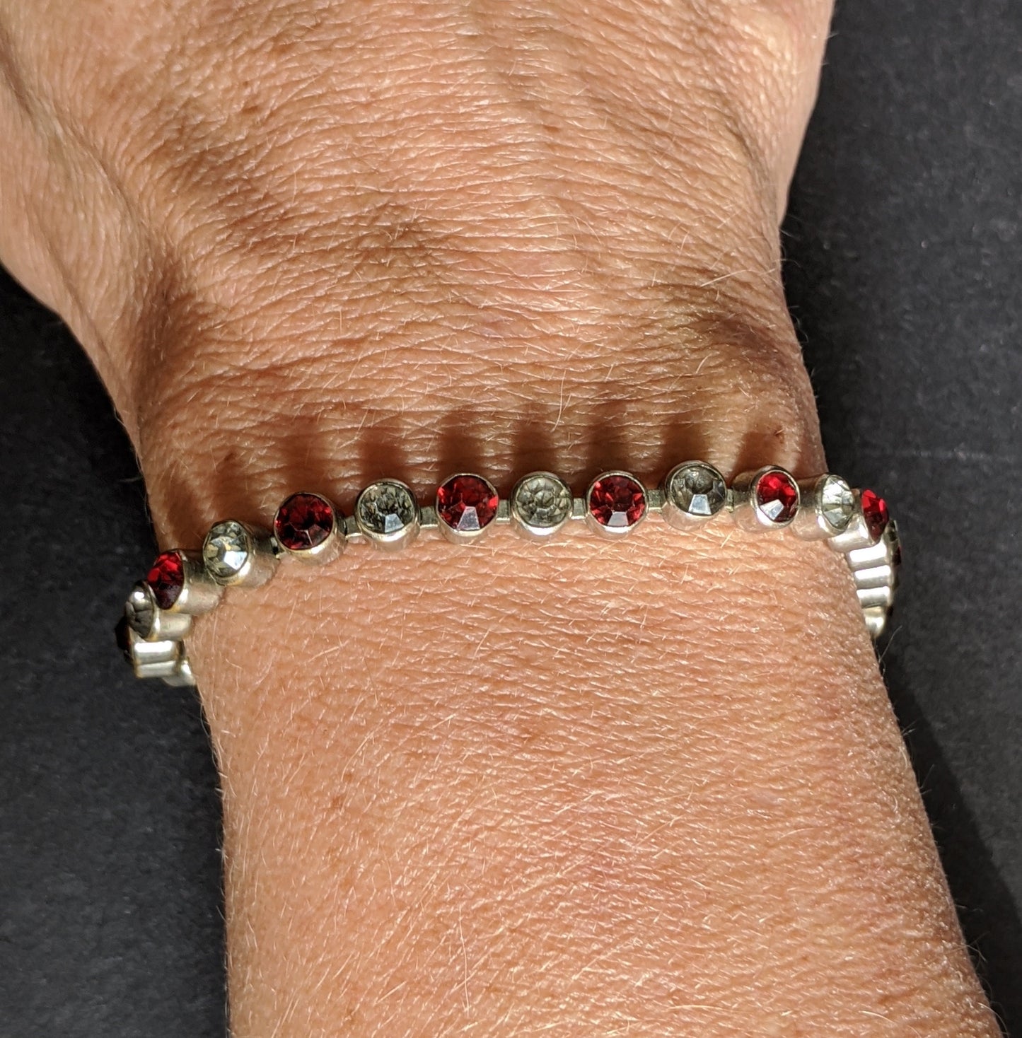 Vintage 1930s Art Deco collet set bright ruby red and clear rhinestone and silver tone tennis / cocktail bracelet