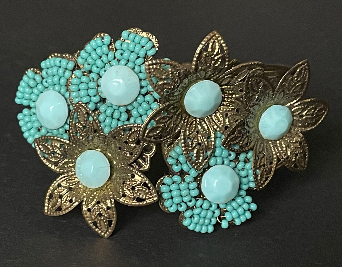 Vintage early Miriam Haskell turquoise blue glass beaded floral clamper bangle with intricate micro beading and gold tone filigree