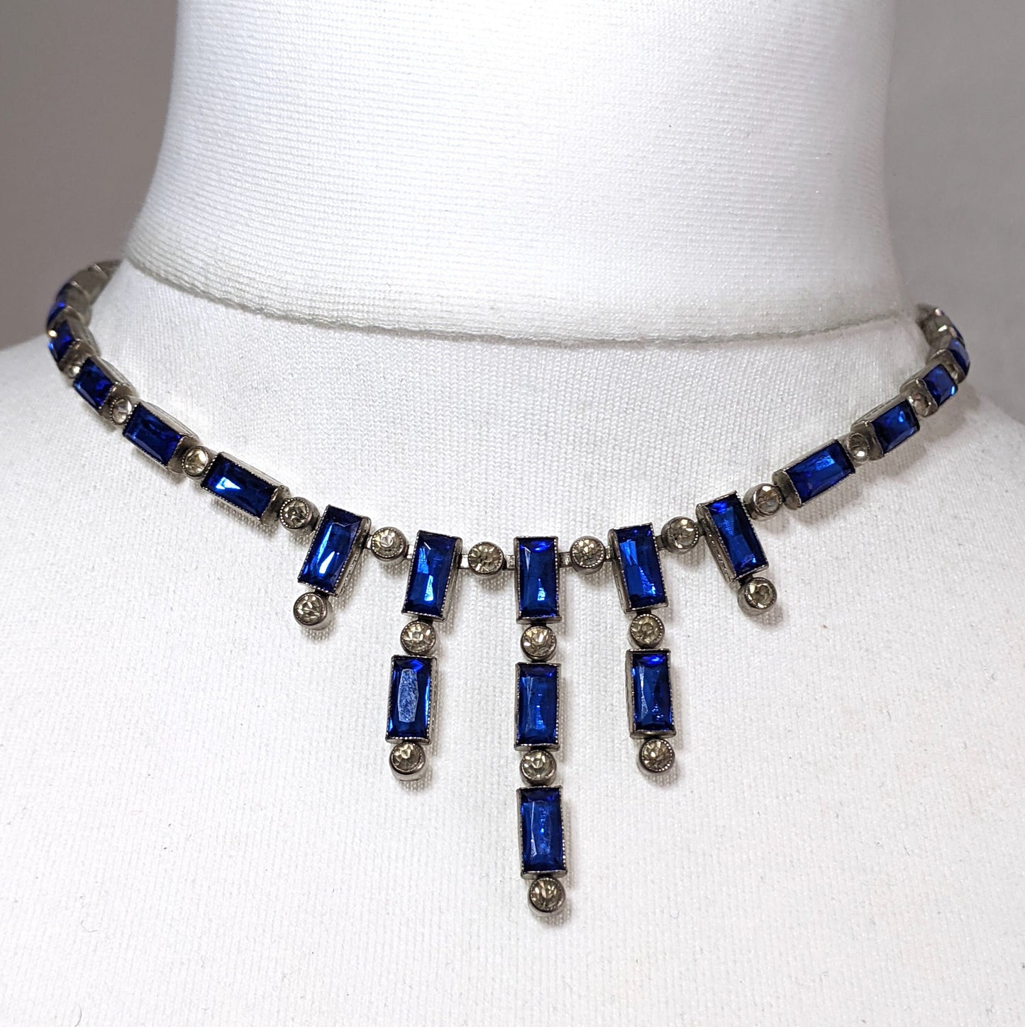 Vintage / antique Bristol blue and clear paste collet set crystal, silver plated riviere necklace with baguette stones and central fringe