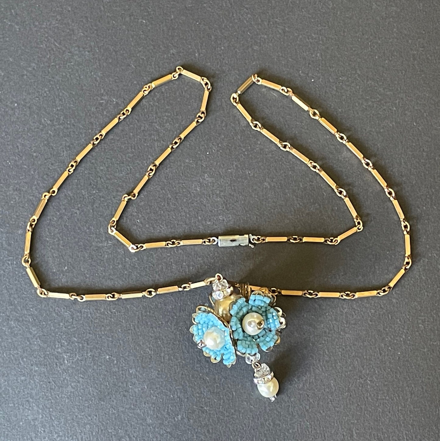 Vintage Miriam Haskell elaborate glass beaded floral  long pendant necklace with intricate turquoise blue micro beading and white faux pearl