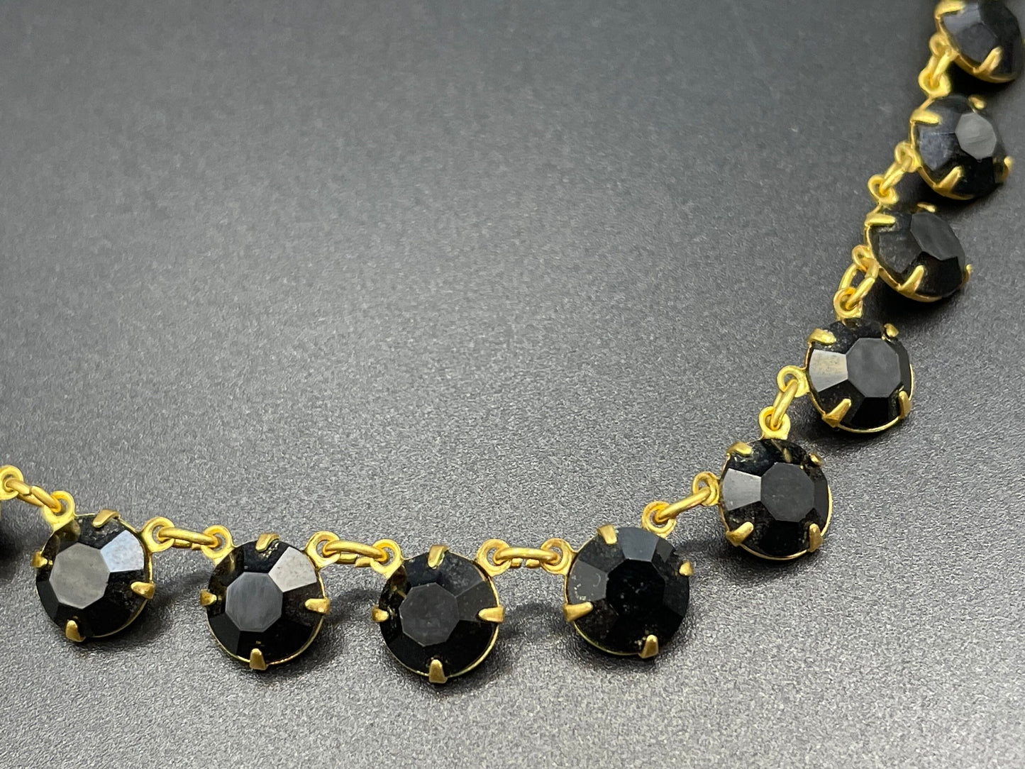 Vintage Art Deco black French jet crystal riviere necklace, single strand, bezel set, open backed rhinestones in gold tone