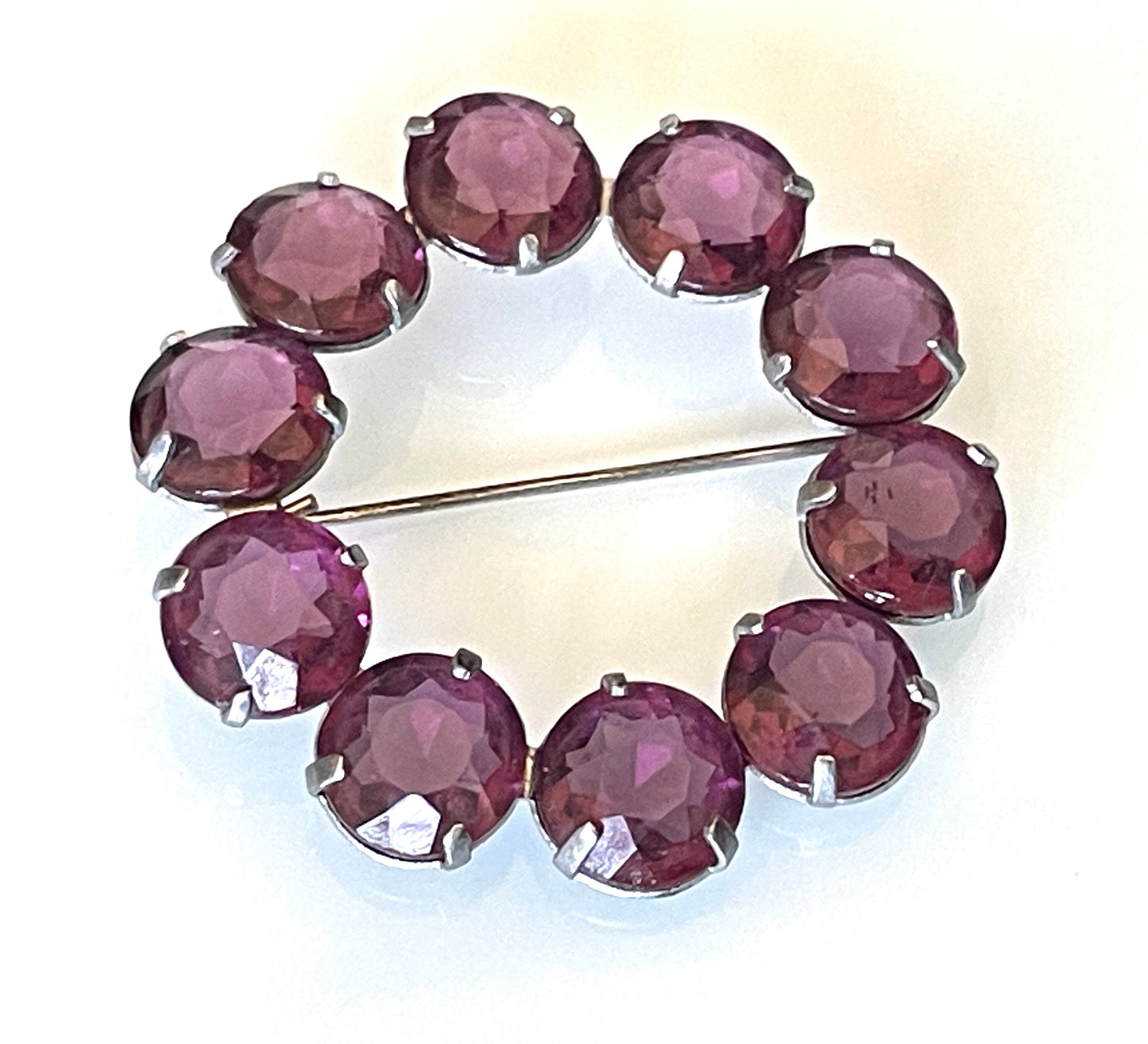 Vintage Art Deco bezel set gorgeous vibrant amethyst purple crystal riviere circle brooch, open-backed rhinestones in silver tone