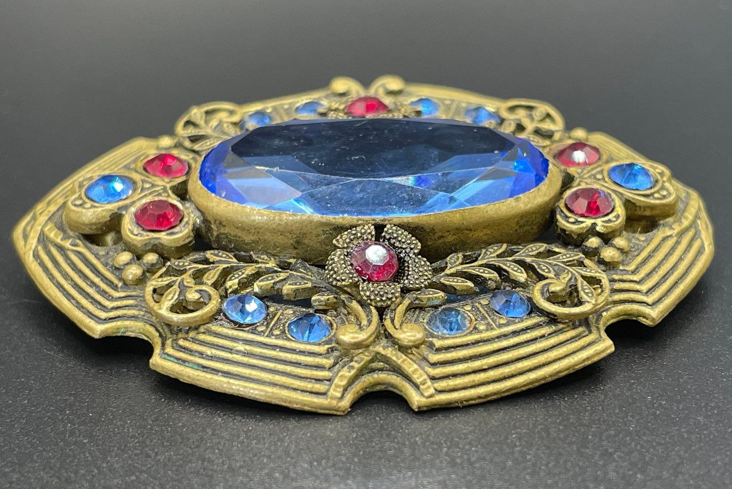 Large vintage Art Deco sapphire blue and bright ruby red rhinestone and ornate gold tone floral design Czech brooch, Neiger style