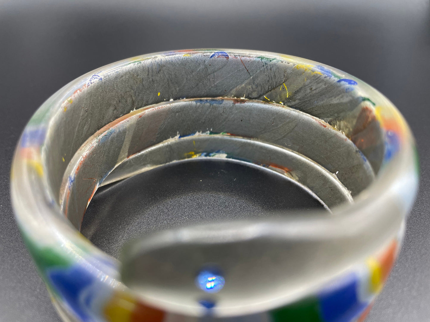 Vintage Art Deco 1920s to 1930s rainbow painted, clear celluloid spiral snake bangle bracelet, blue rhinestone eyes