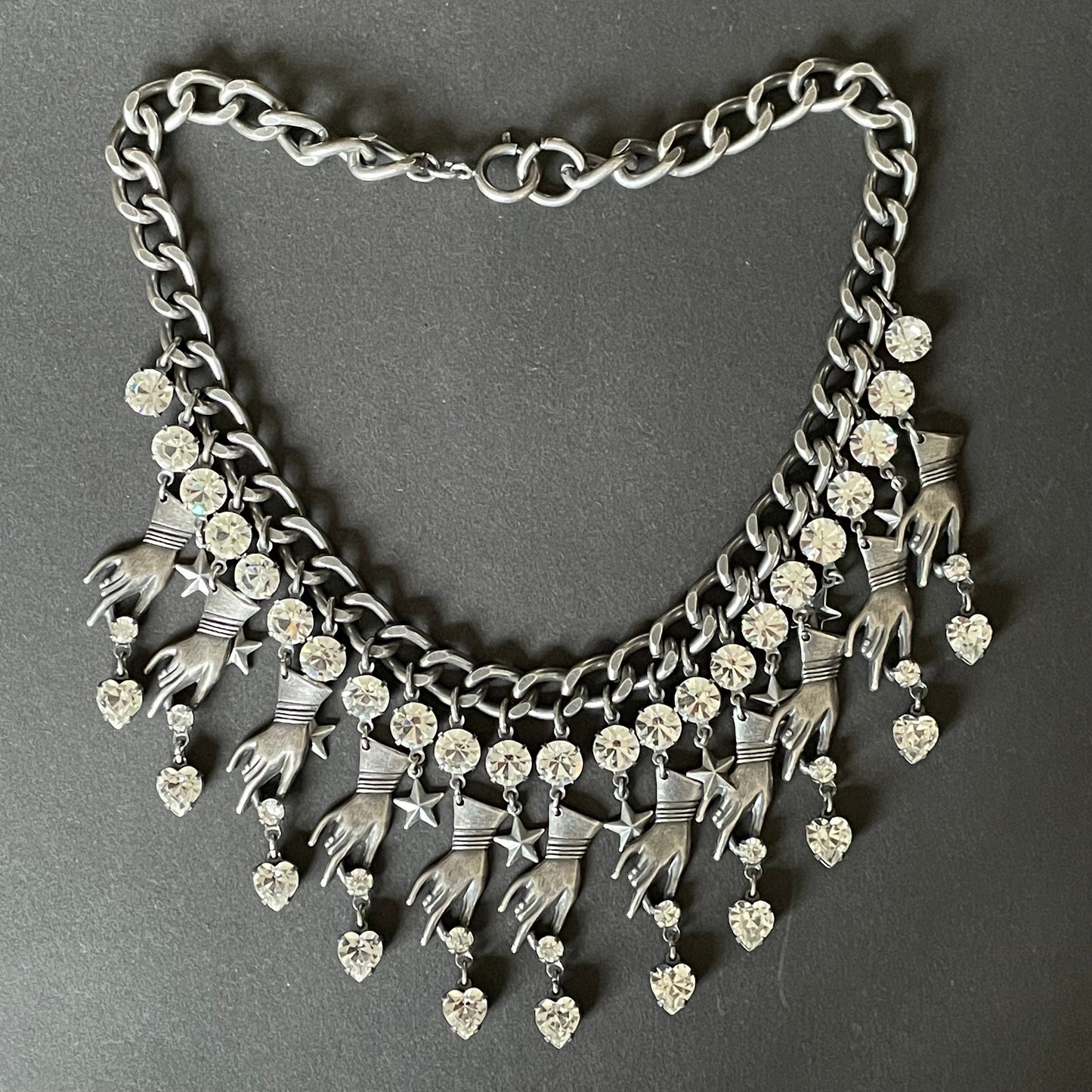 Vintage early Askew London hand, heart and star heavy fringe necklace, statement piece in chic dark silver tone & clear rhinestone, unique