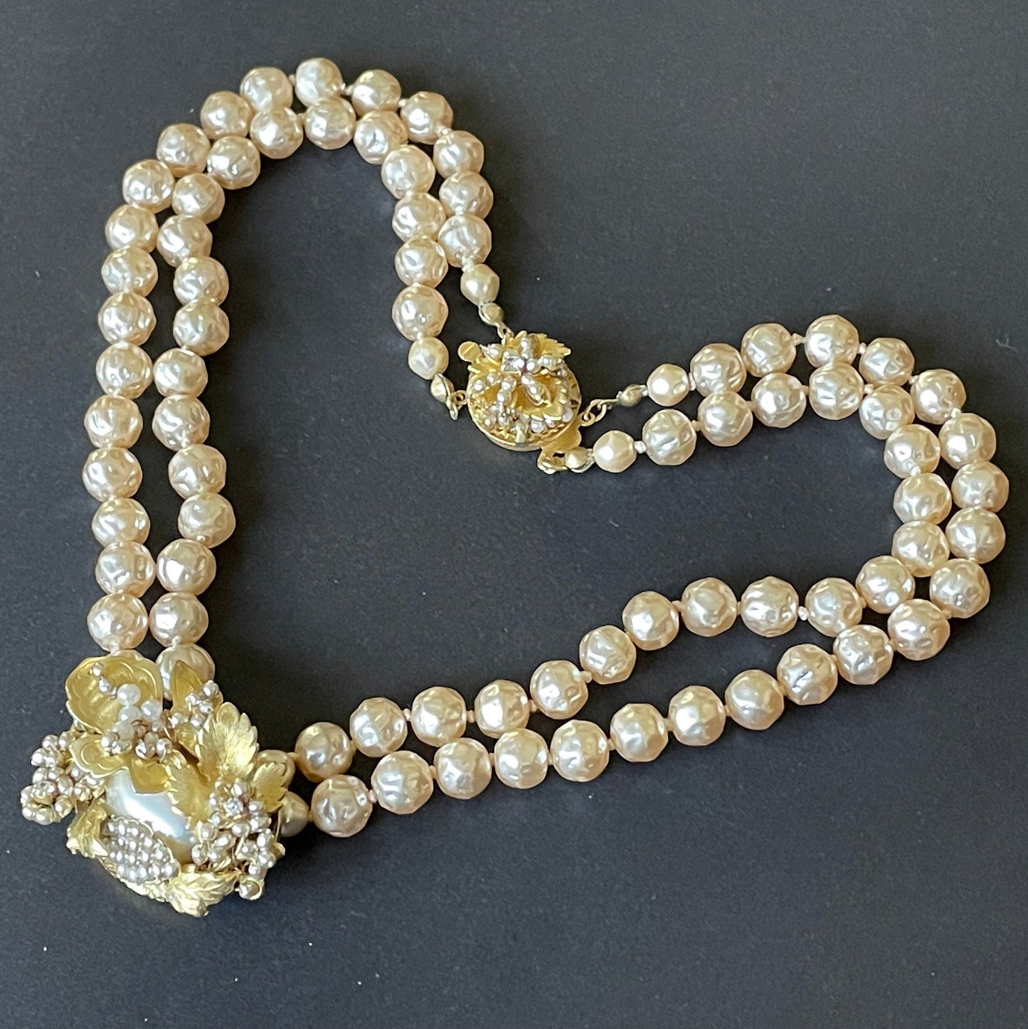 Vintage Miriam Haskell pale pink dimpled baroque pearl double strand necklace with ornate centrepiece and box clasp