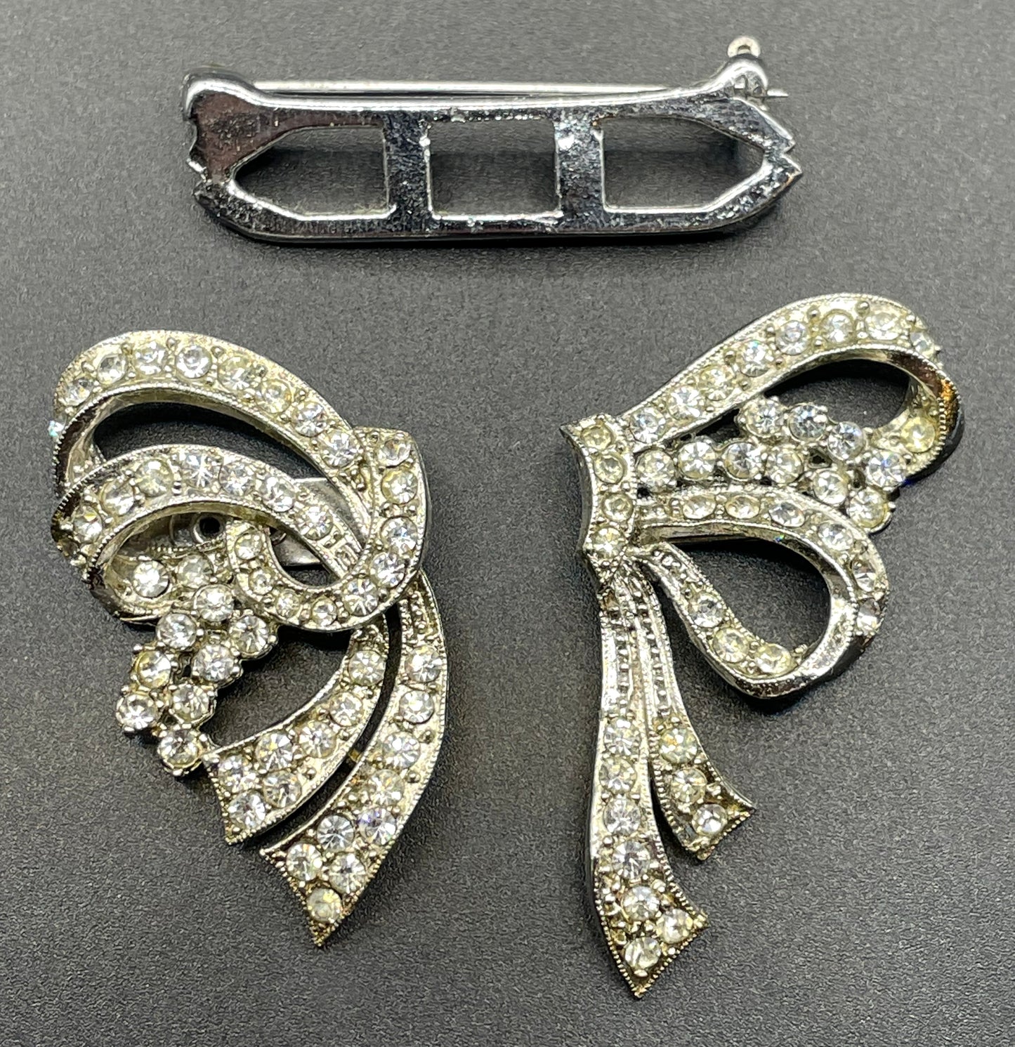 Vintage Art Deco asymmetric bow design duette - a beautiful metamorphic rhinestone brooch which can be converted to two dress clips