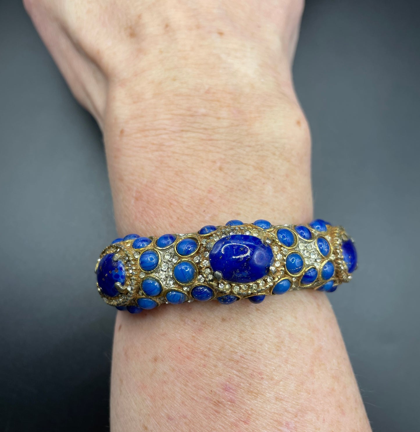 Vintage Kenneth Jay Lane KJL classic 1960s signed mogul style cabochon & rhinestone encrusted hinged bangle, lapis lazuli blue glass stones