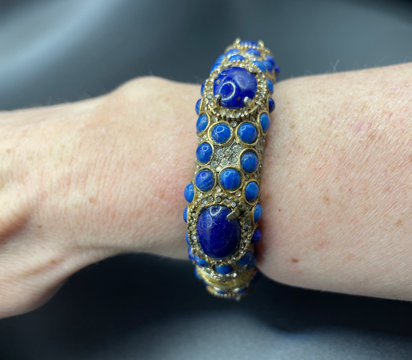 Vintage Kenneth Jay Lane KJL classic 1960s signed mogul style cabochon & rhinestone encrusted hinged bangle, lapis lazuli blue glass stones