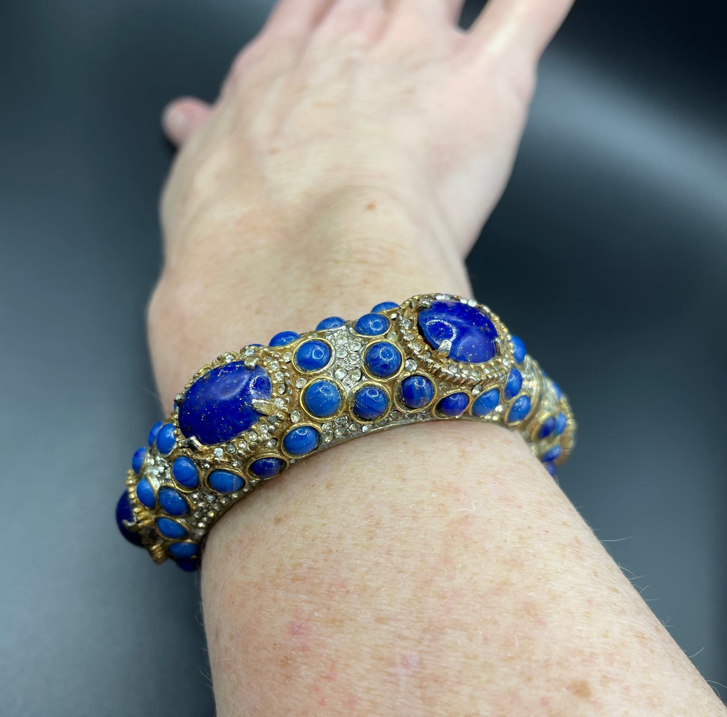 Vintage Kenneth Jay Lane KJL classic 1960s signed mogul style cabochon & rhinestone encrusted hinged bangle, lapis lazuli blue glass stones