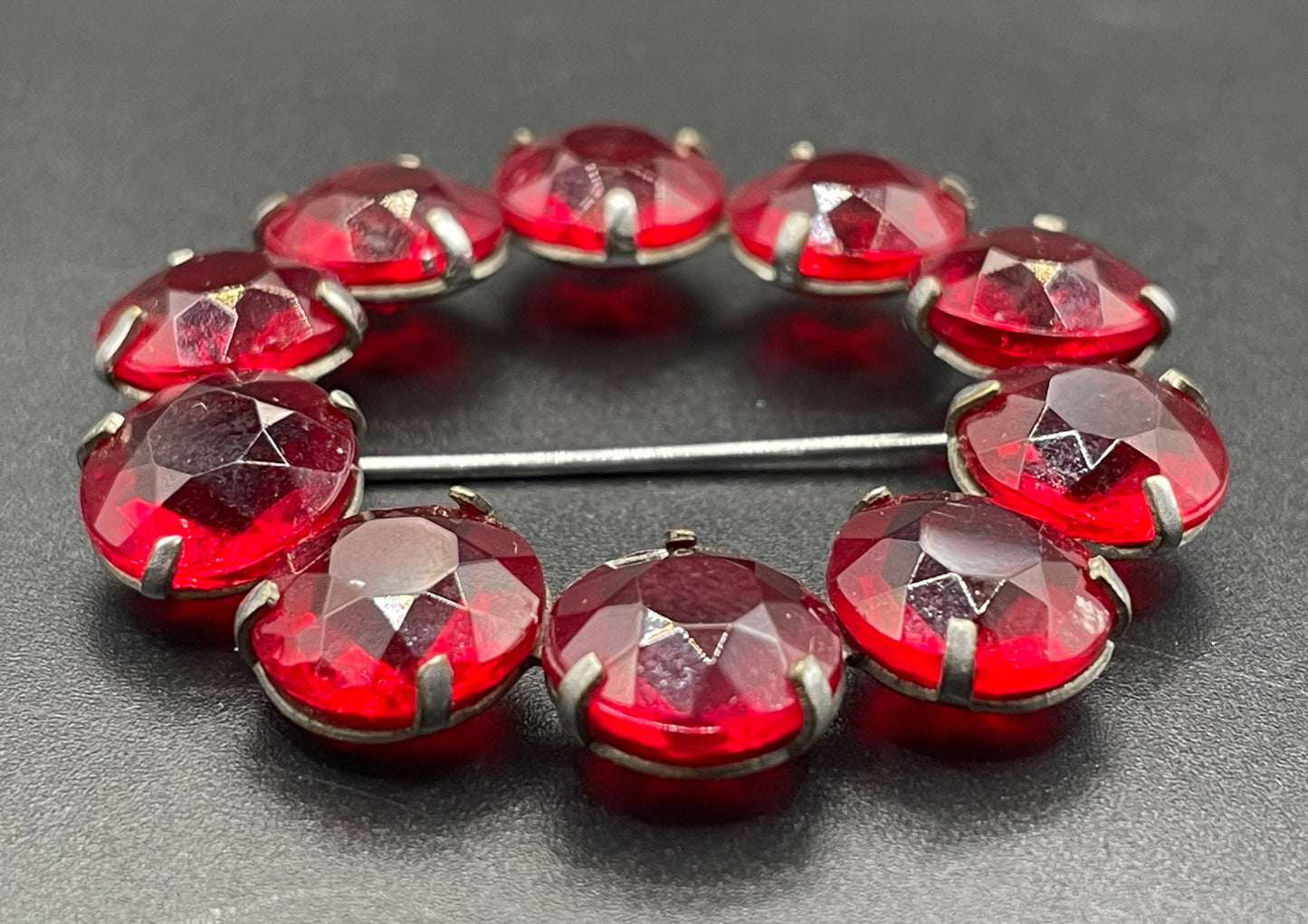 Vintage Art Deco bezel set gorgeous vibrant ruby red crystal riviere circle brooch, open-backed rhinestones in silver tone (Copy)