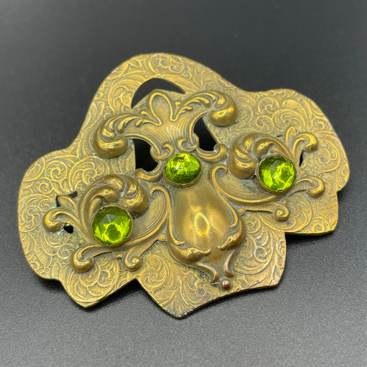 Large vintage Art Nouveau peridot green rose cut rhinestone and ornate repousse gold tone brooch sash pin