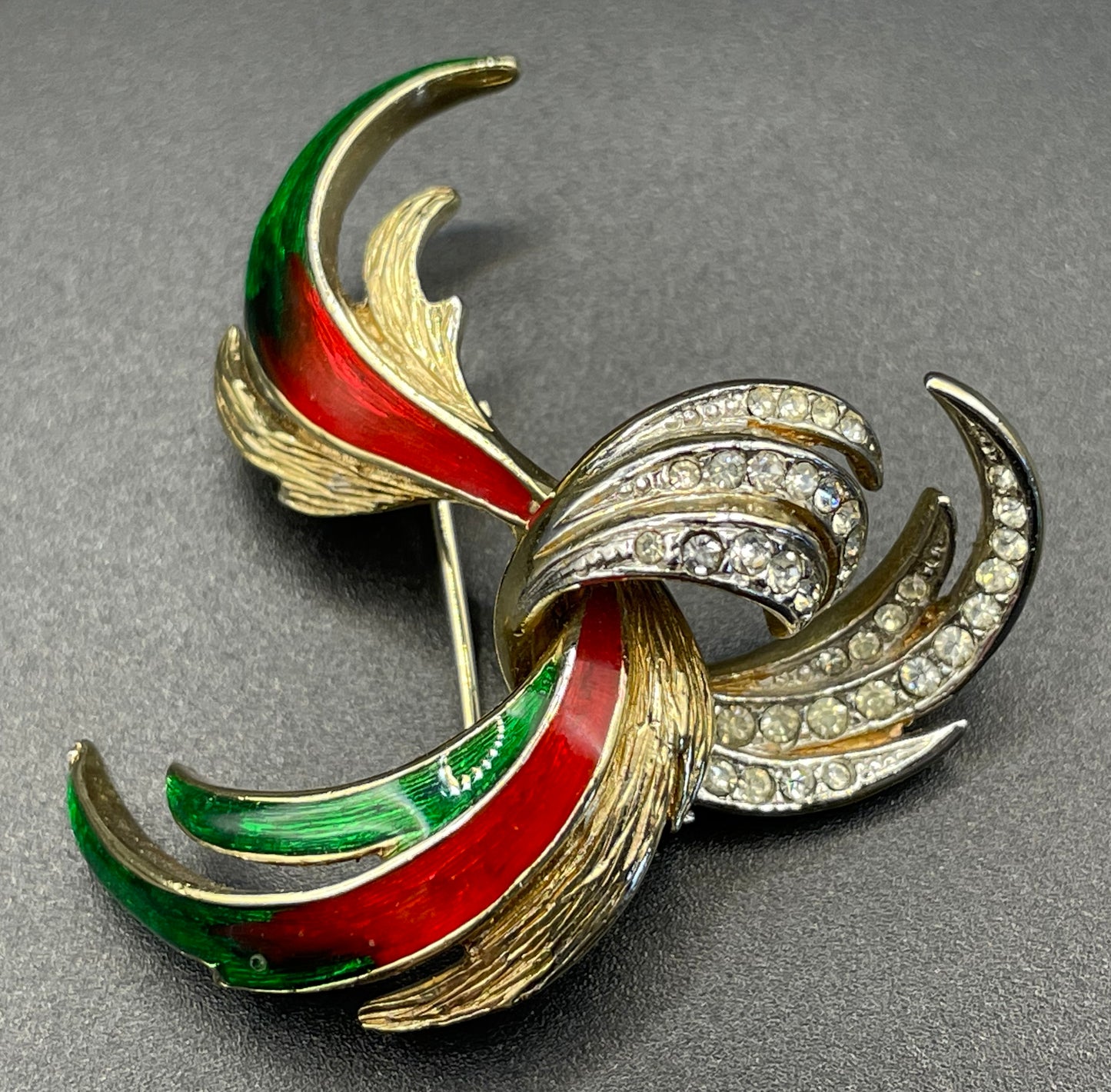 Vintage Attwood and Sawyer abstract swirl brooch, 22ct gold plated, red and green enamel and clear rhinestones, signed A&S