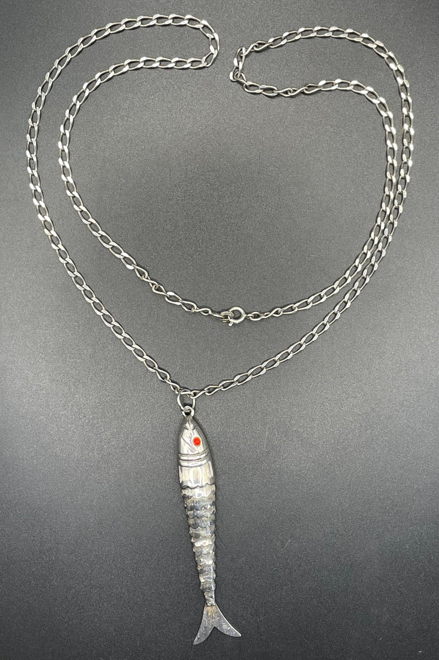 Vintage / antique large sterling silver articulated fish pendant, ruby red rhinestone eyes, with long hallmarked 28 inch silver chain, 19 grams