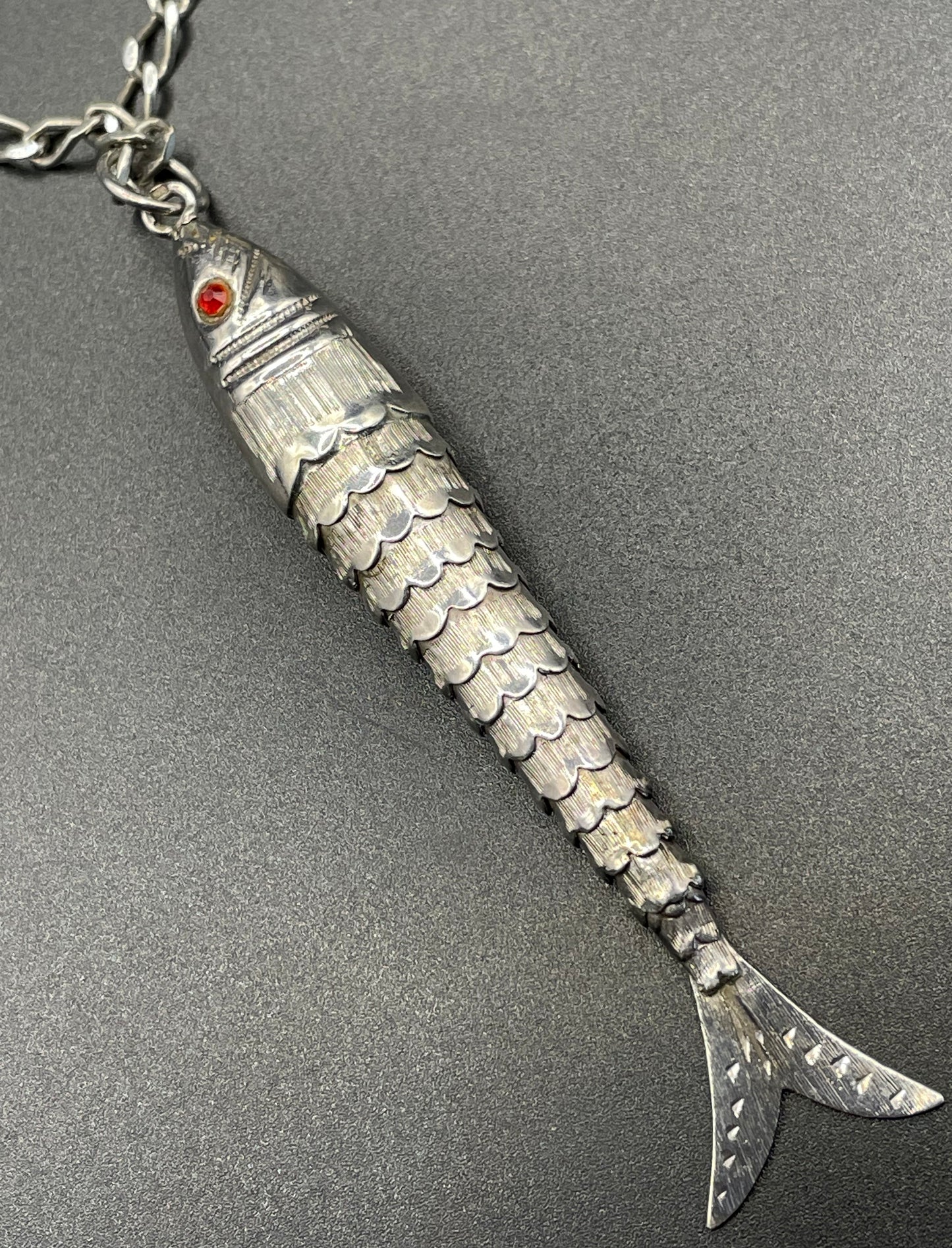 Vintage / antique large sterling silver articulated fish pendant, ruby red rhinestone eyes, with long hallmarked 28 inch silver chain, 19 grams