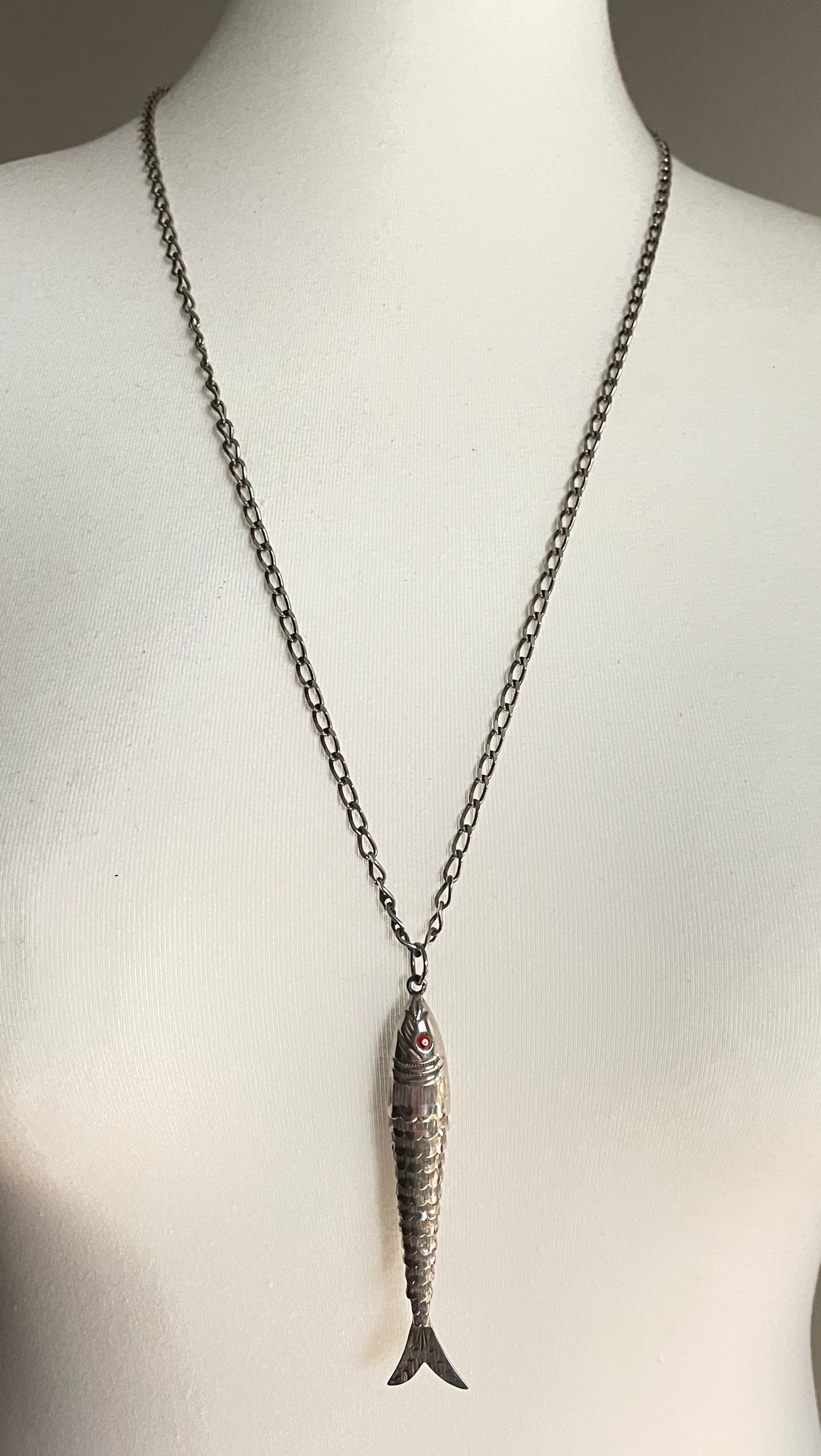 Vintage / antique large sterling silver articulated fish pendant, ruby red rhinestone eyes, with long hallmarked 28 inch silver chain, 19 grams