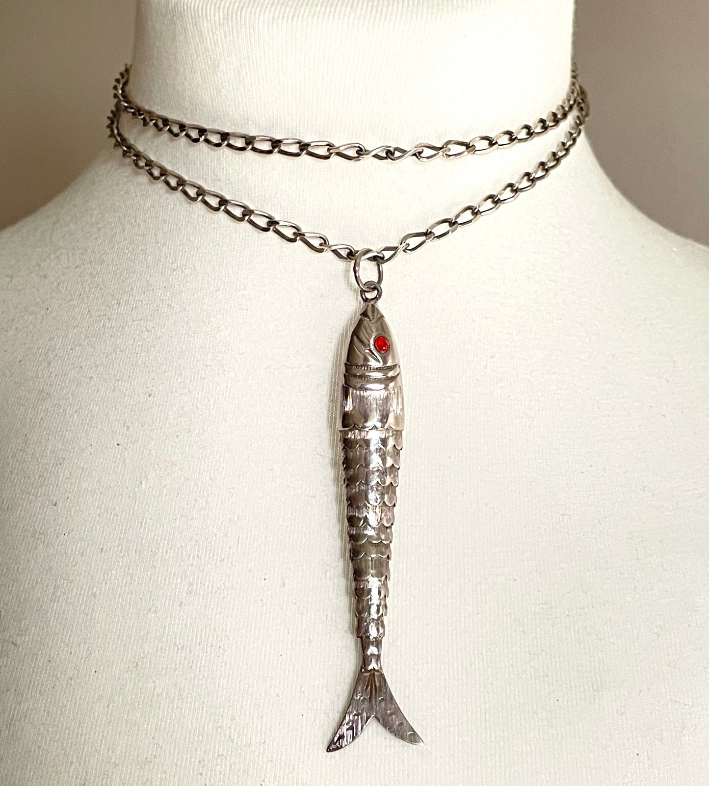 Vintage / antique large sterling silver articulated fish pendant, ruby red rhinestone eyes, with long hallmarked 28 inch silver chain, 19 grams