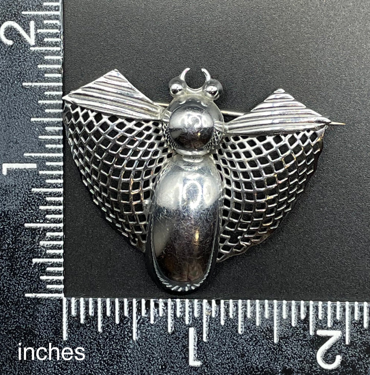 Vintage Art Deco machine age chrome stylised moth or butterfly bug brooch, 1930s