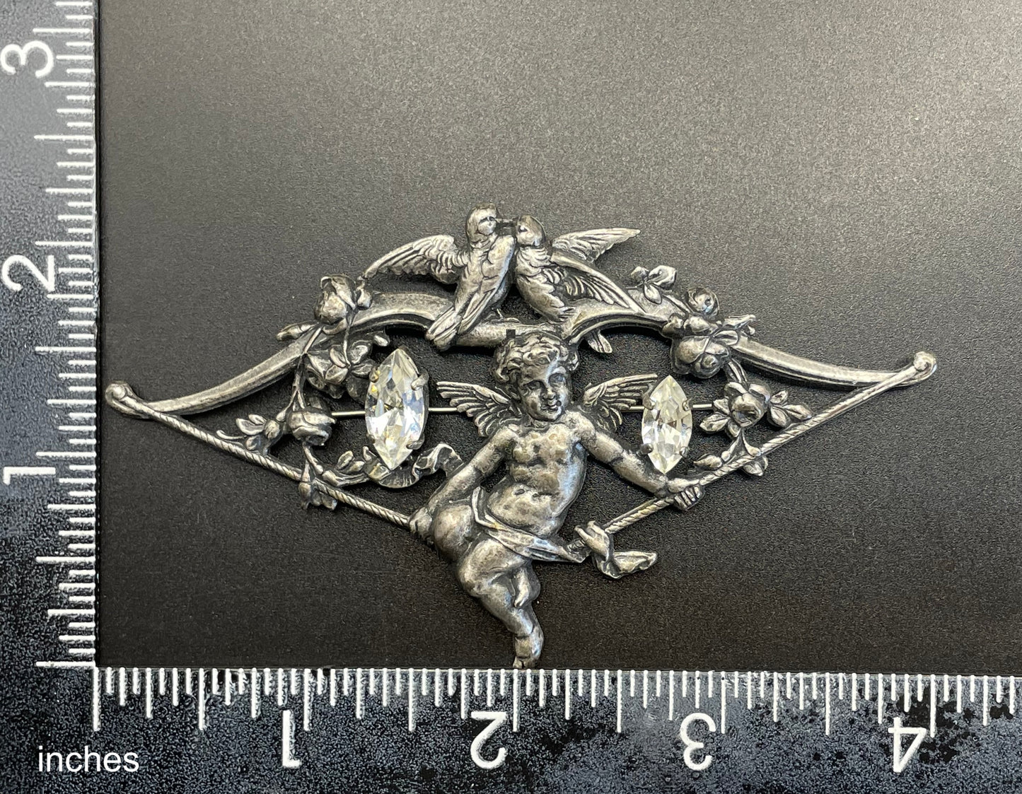 Large early Askew London, vintage cupid brooch in antique silver tone with marquise cut clear rhinestones, cherub / putti & love bird design